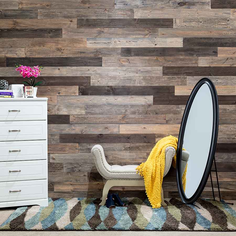 Rustic Grove Mixed-Brown planks with mirror on bedroom wall.